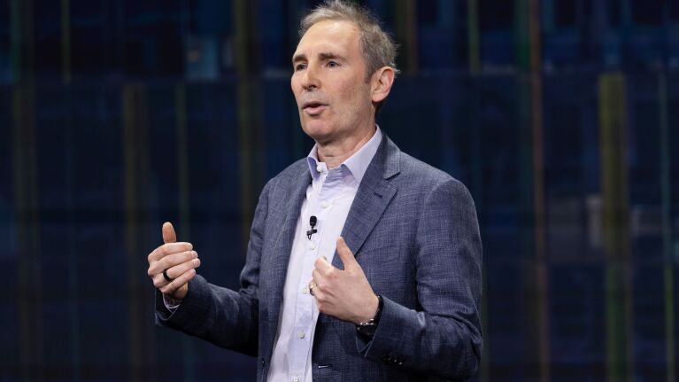 Amazon CEO Andy Jassy speaking on stage during presentation