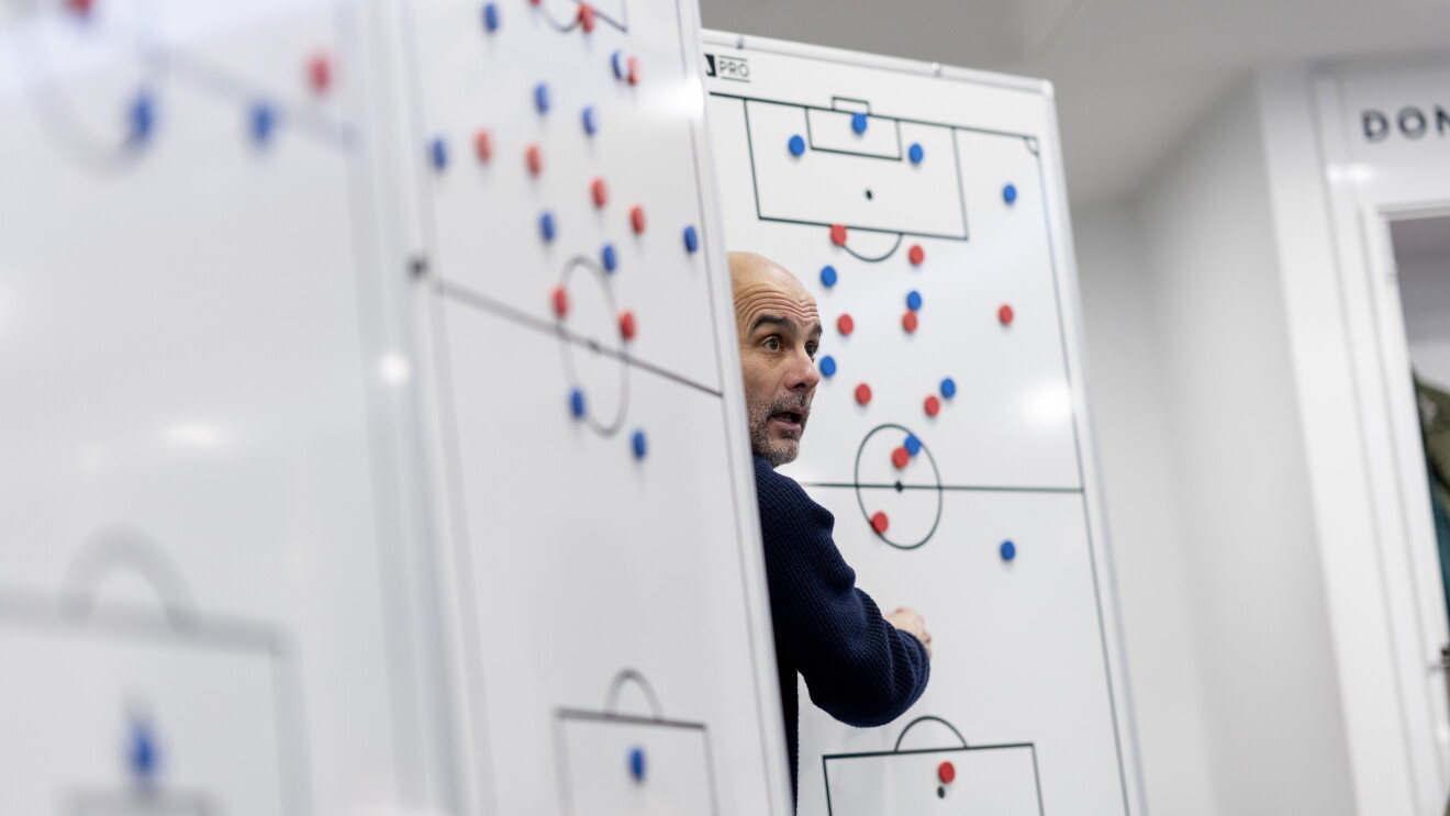 Pep Guardiola stands by whiteboards mapping out football tactics 