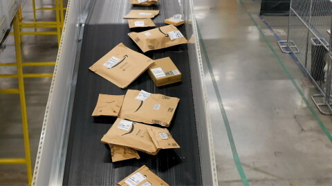 Packages on conveyor belt in warehouse
