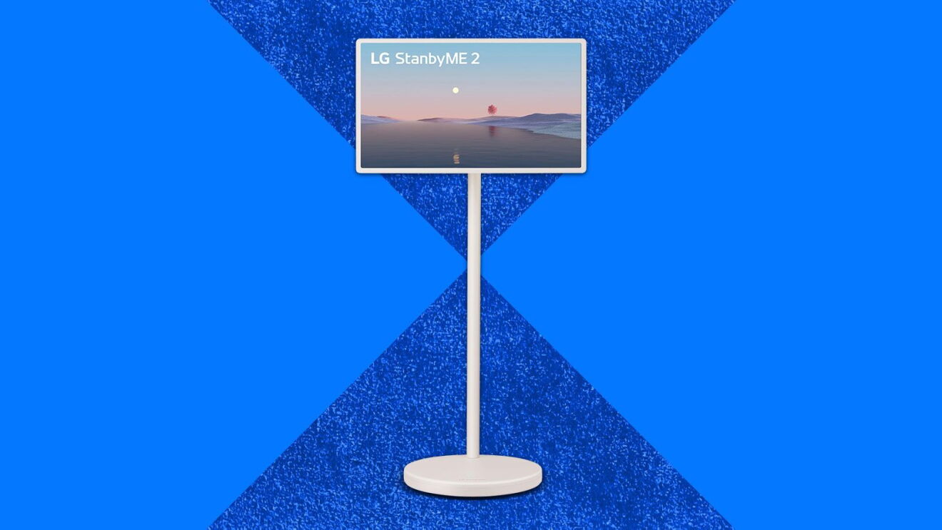 LG StanbyME 2 display on stand with desert sunset screensaver