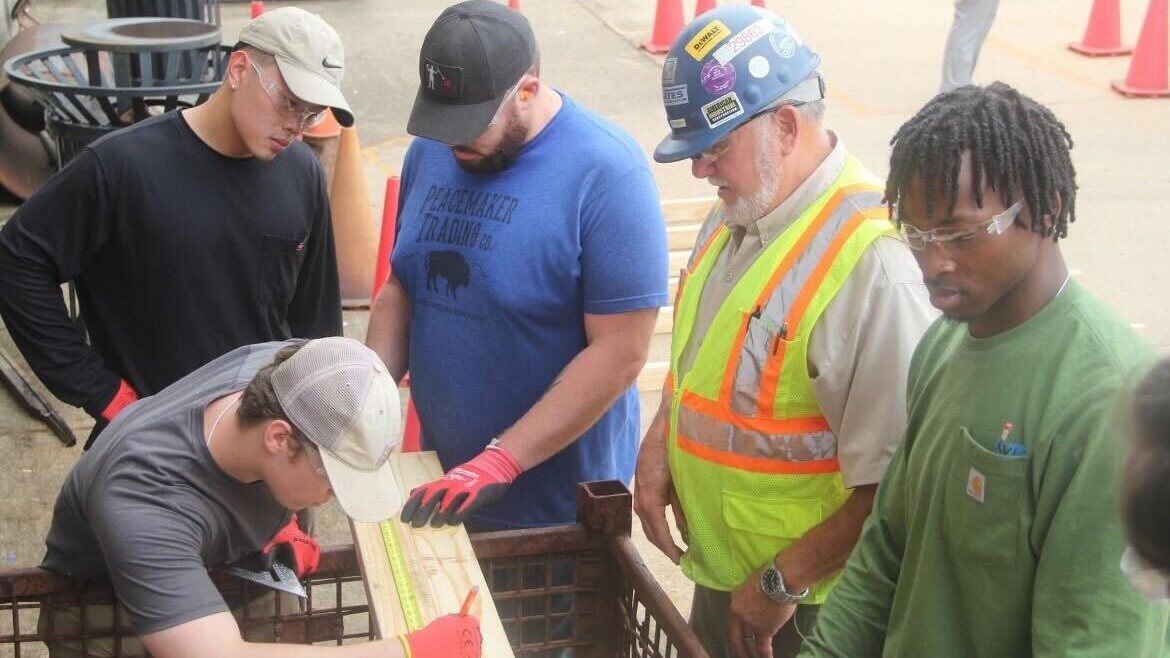 Diverse team inspecting materials on construction project
