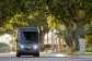 An Amazon-branded Rivian vehicle drives through the streets in Southern California.