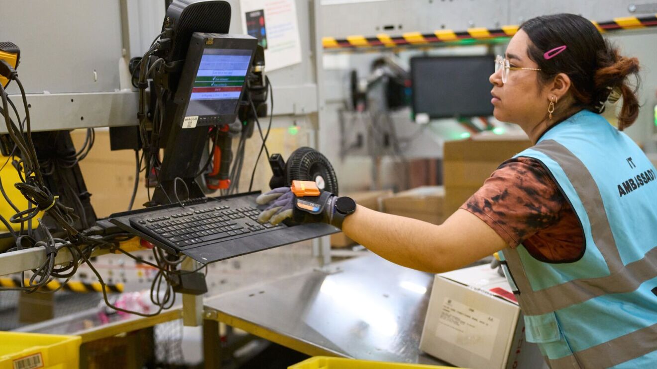 Image of an employee working in an Amazon fulfillment center.