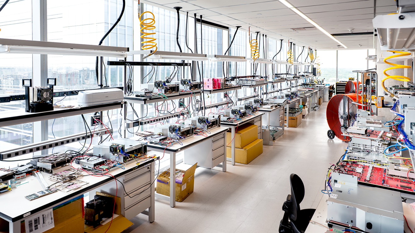 High-tech electronics lab with workstations and testing equipment