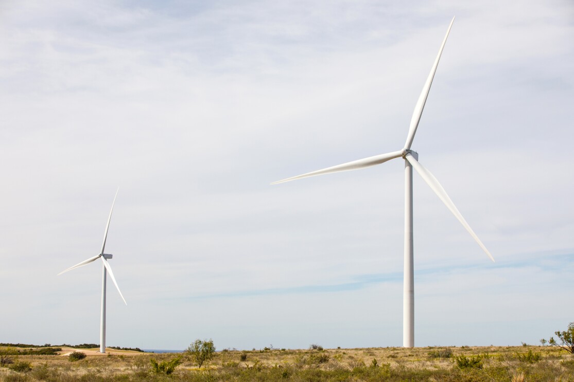 An image of an Amazon windfarm in a field in Texas