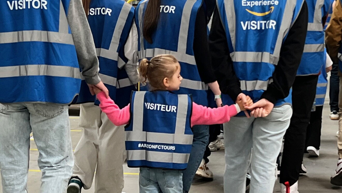 Amazon employees with their children at an FC
