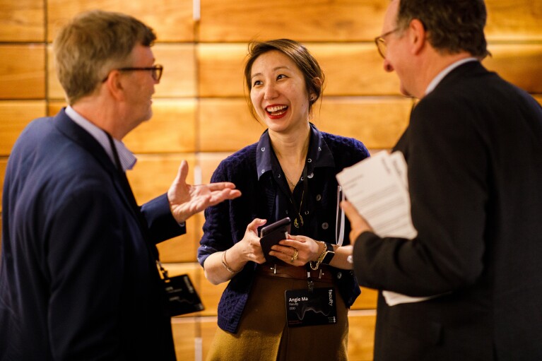 Angie Ma with two colleages smiling