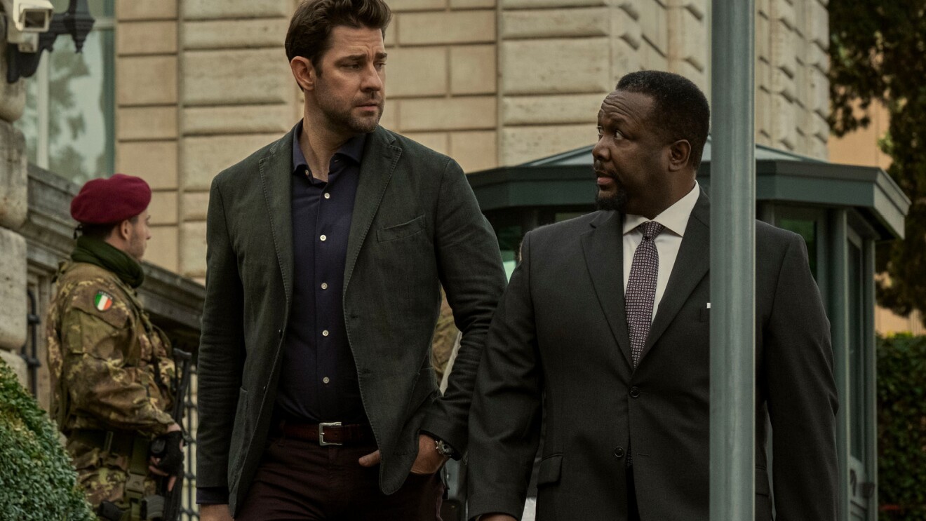 A still shot from Tom Clancy's Jack Ryan, showing two characters talking and walking.