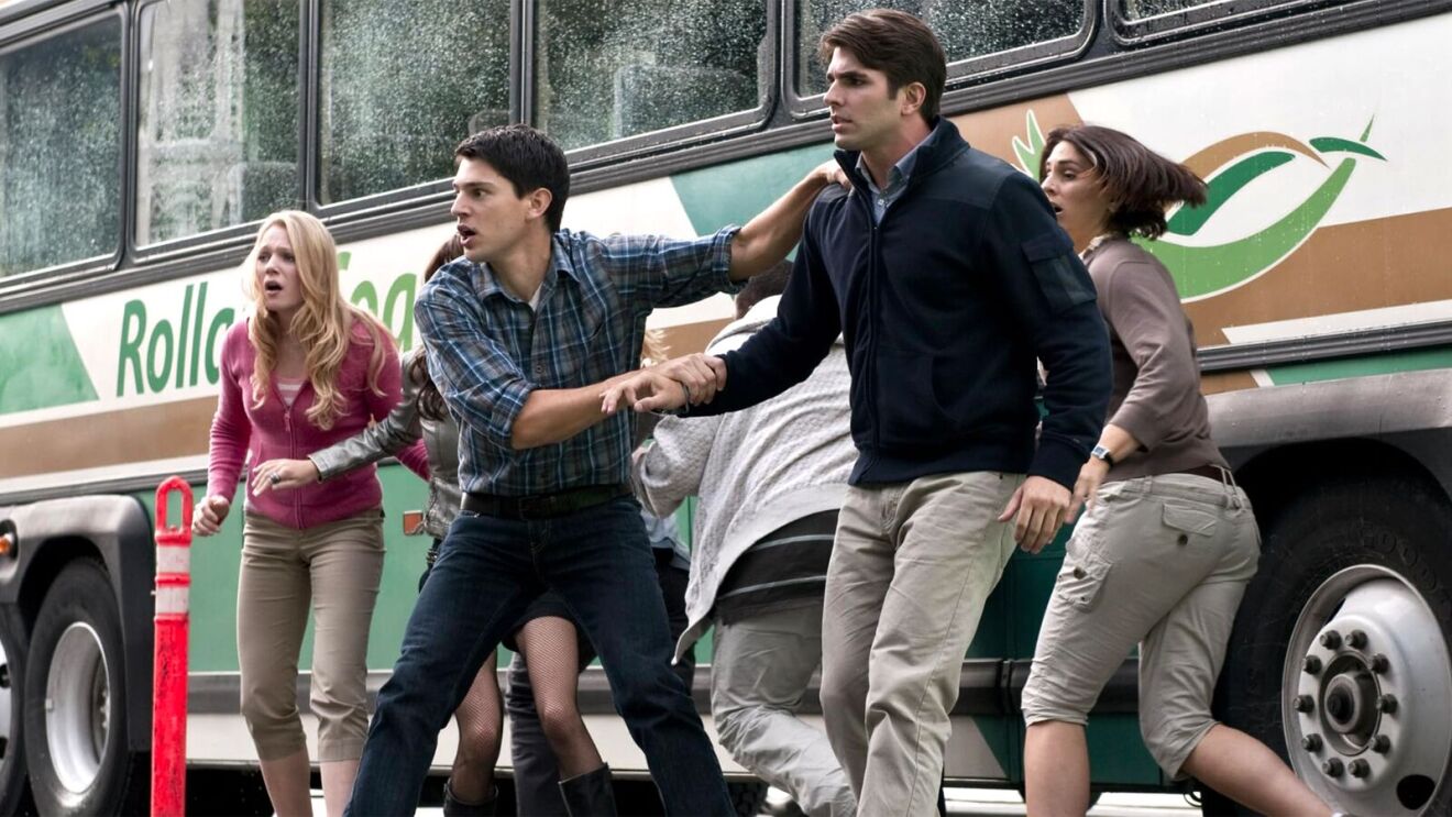 Group of young adults reacting urgently near a bus