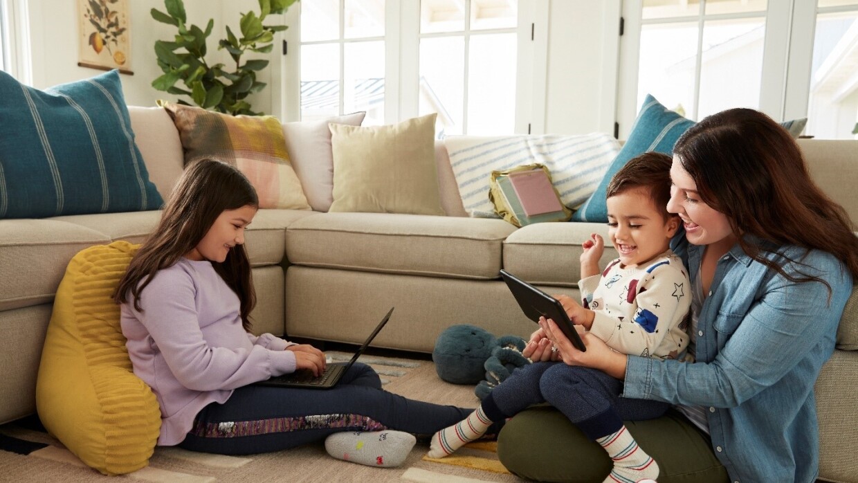 Parent with two young children, accessing parent-approved games and apps