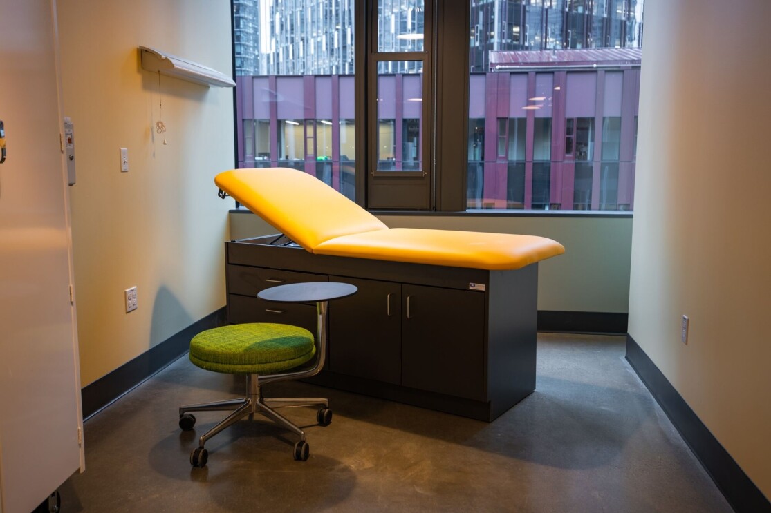 An image of a room with a reclined chair and a small stool where Mary's Place guests can receive medical care from on-staff nurses and medical professionals volunteering their time. 