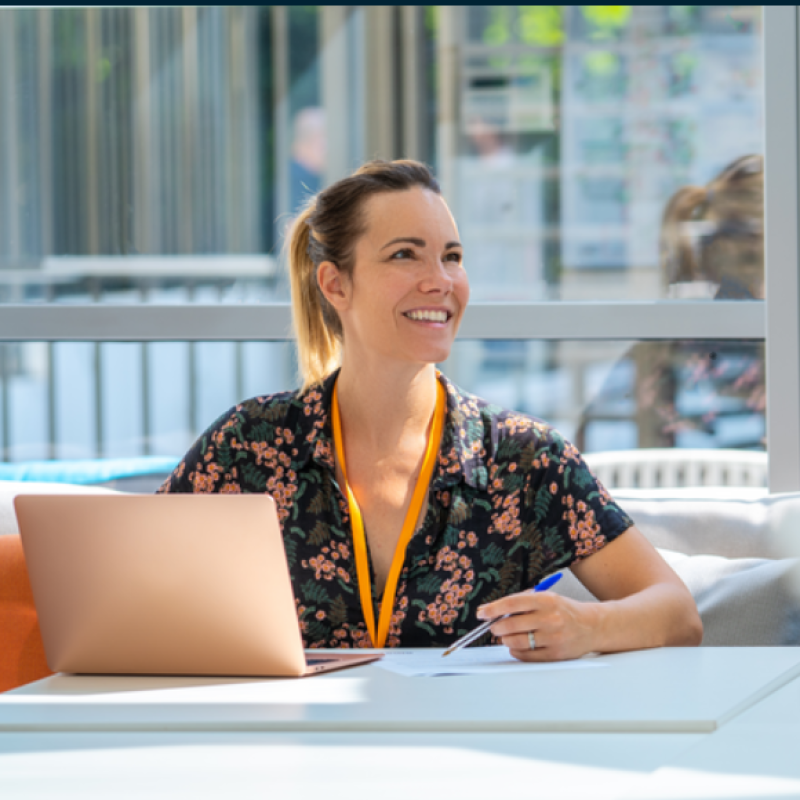 Photo of woman using her laptop in the Amazon France corporate office