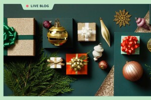 An image of various items against a hunter green background. The items include wrapped gifts in glittery gold paper with green and white bows and ribbons, tree ornaments of various shapes and sizes, and evergreen tree branches. There is a light green border around the whole image and a tag at the top that reads "LIVE BLOG" with a red dot next to it.