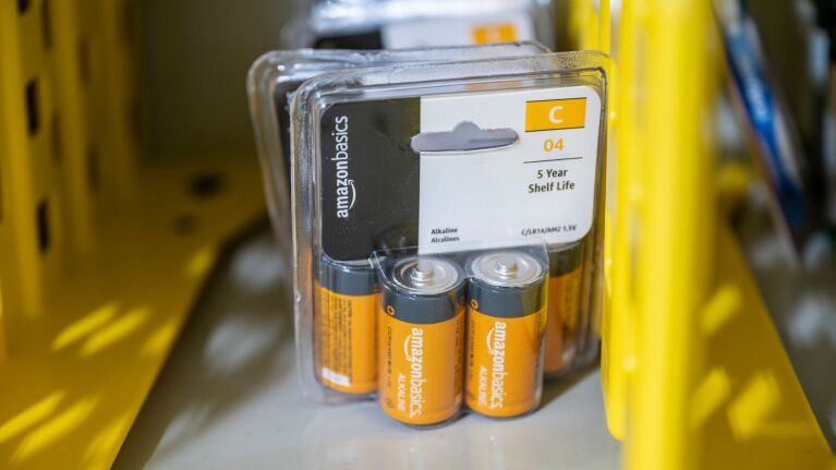 An image of Amazon Basics batteries sitting on a shelf inside the Amazon drone delivery facility in Texas.