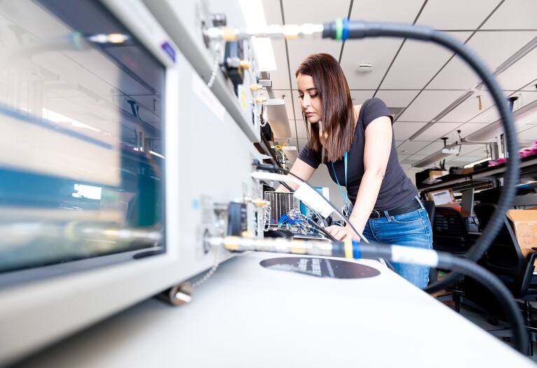 A woman working in the AWS chip lab.