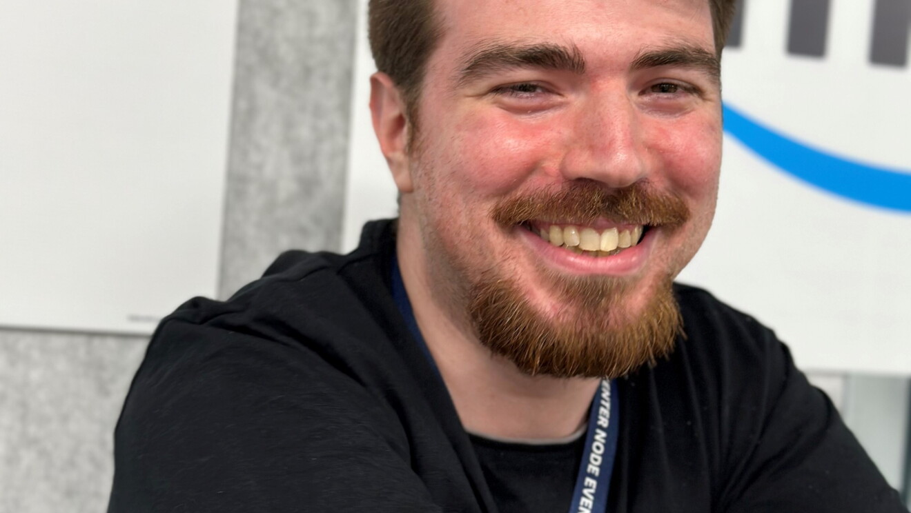 Men and women smiling in our sites for Pride month