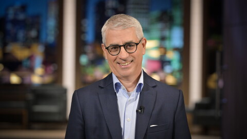 Man with glasses smiling