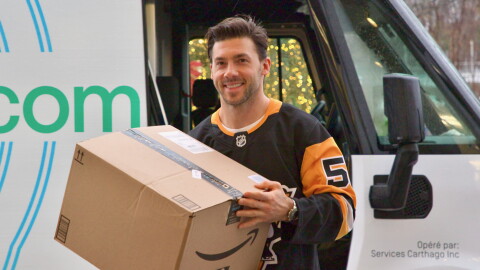 hockey player holding box