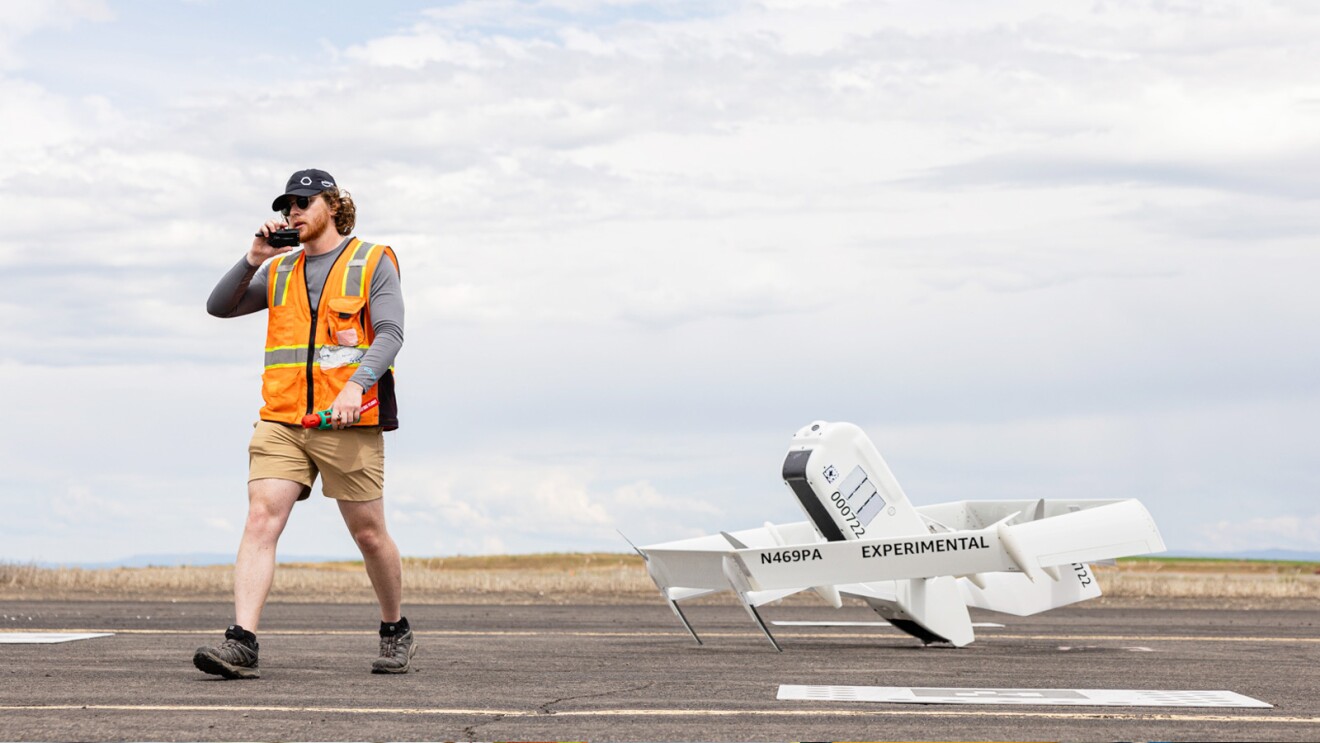 Images of an Amazon employee wearing an orange safety vest next to an Amazon drone. Images of a drone in air.