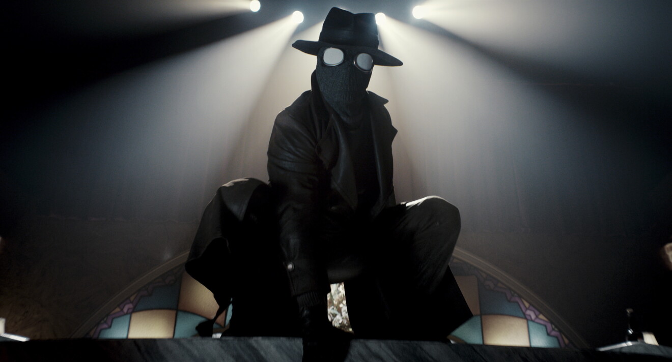 person in mask crouching 