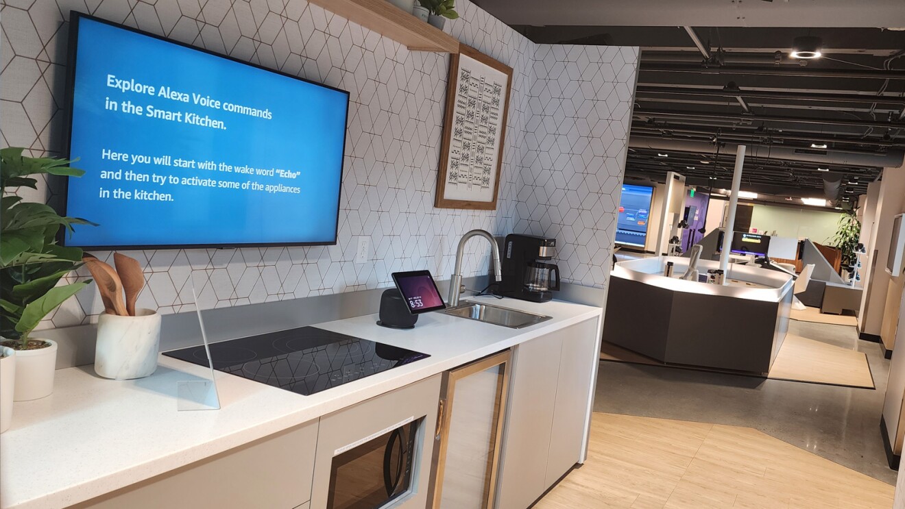 An image of the AWS Skills Center Alexa exhibit. There is a mock kitchen with Alexa-enabled devices in it.