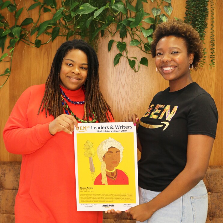 Amazon employee, Aisha Suleiman, holding artwork with artist Onyinye Iwu