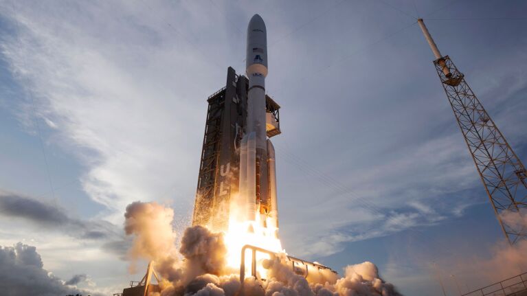 Project Kuiper rocket launching from pad with bright flames and smoke