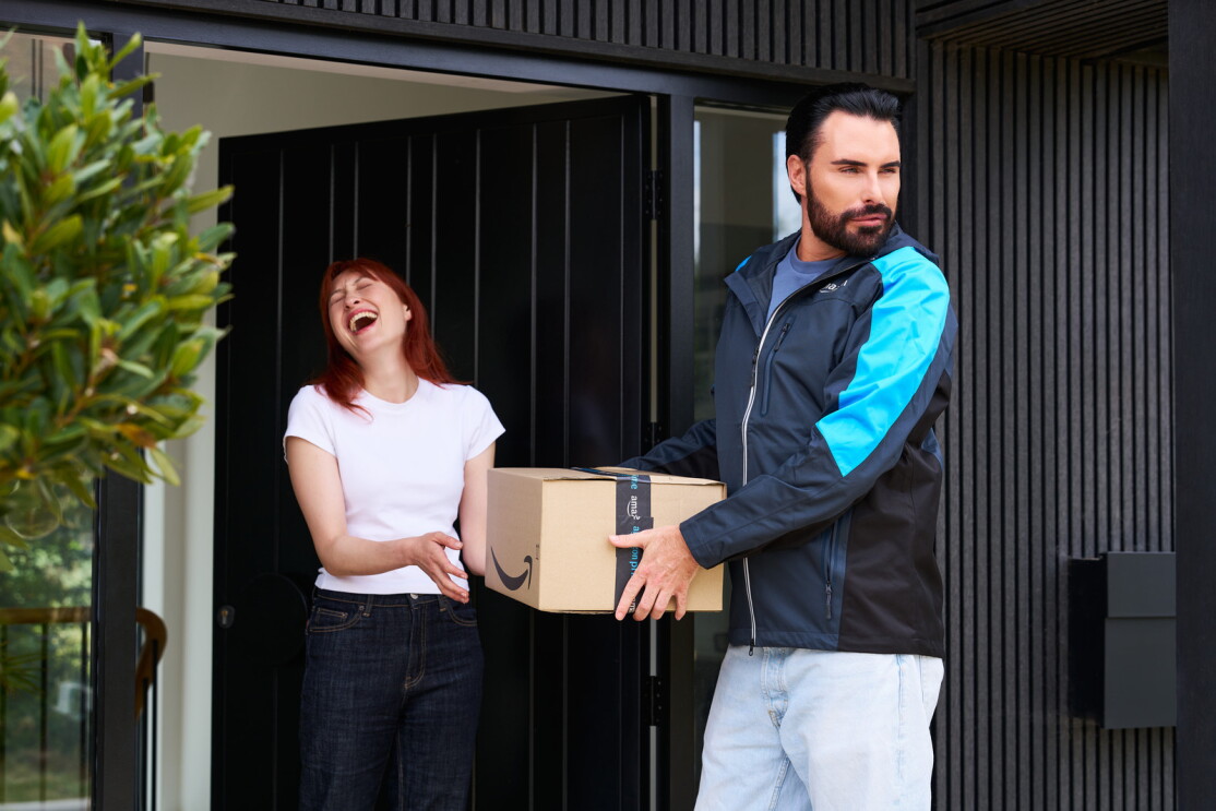 Rylan hands a prime parcel to a prime customer