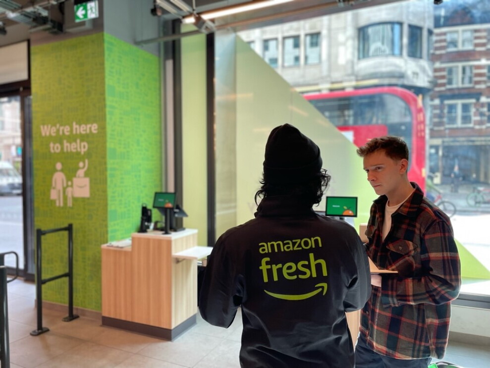 The author Tom speaks to an Amazon Fresh employee in the store