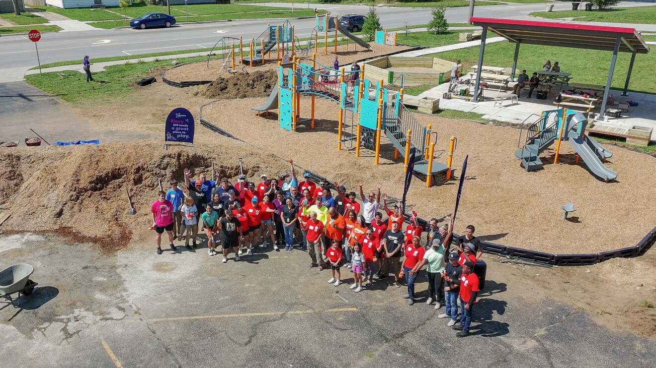 Community volunteers gathered at playground construction site
