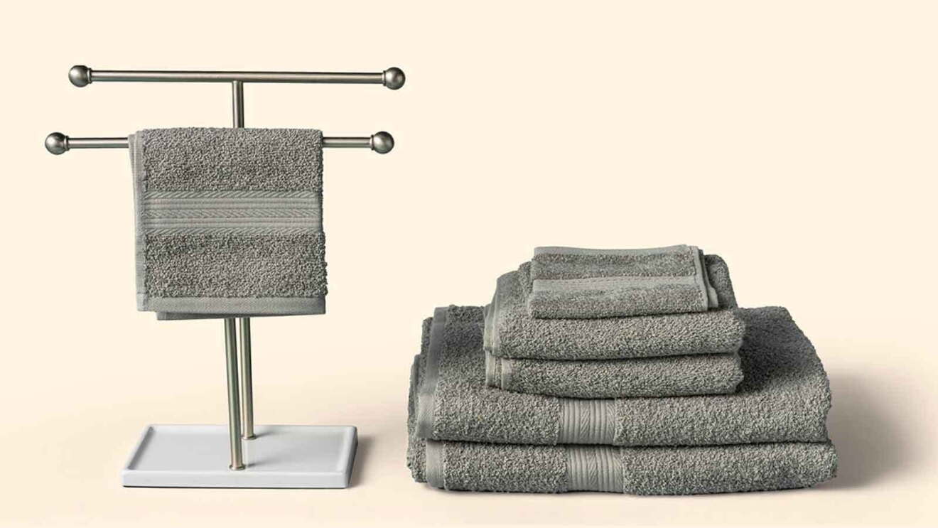 Prime Day 2023 live blog best deals: folded grey towels with one towel hanging on a rack.