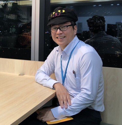 Noboru Obata, a Senior Account Manager on the Amazon Prime team and Co-Chair of the PwD Japan affinity group, smiles for a photo.