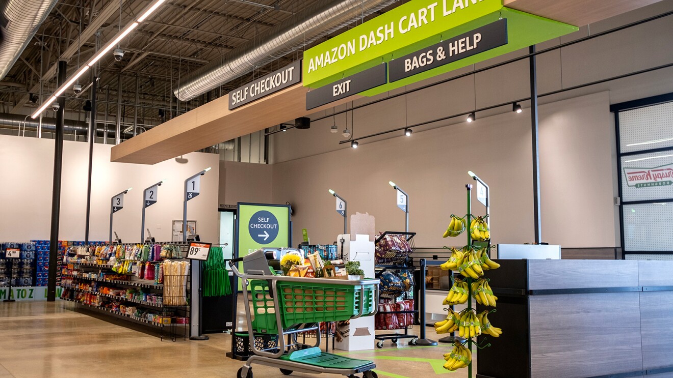 A photo of a self checkout stand within an Amazon Fresh store.