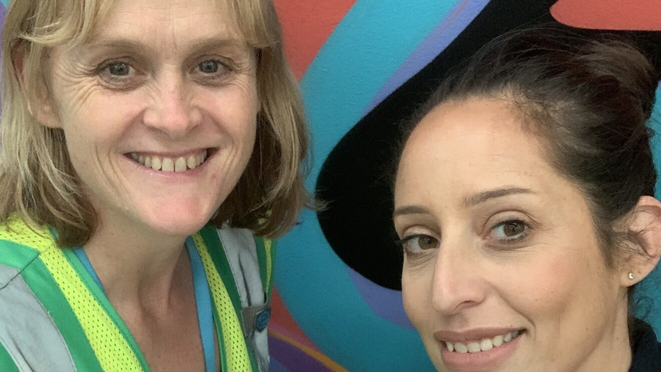 Two MEL1 women employees smile at the camera.
