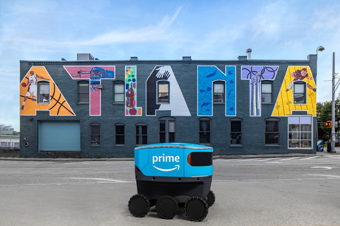 Amazon Scout bot posed in front of iconic landmarks