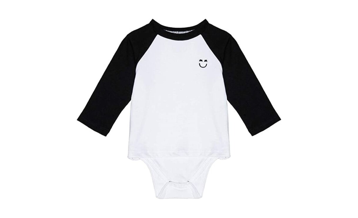 A product image of neutral baby clothes from Miles and Milan.