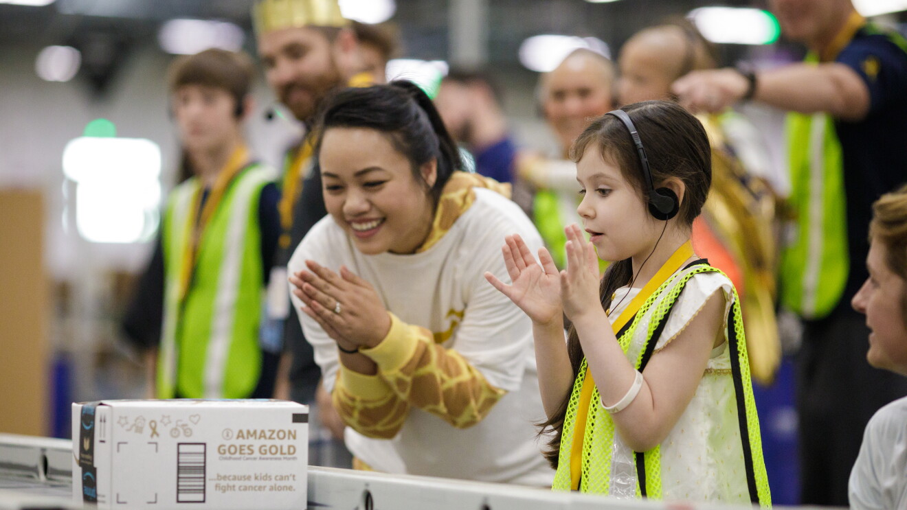 Scenes from Amazon's BFI4 fulfillment center, as part of Amazon Goes Gold and the PJammin' challenge, photographed Wednesday, Sept. 6, 2017. In September, Childhood Cancer Awareness Month, Amazon is helping raise awareness by delivering 10 million uniquely designed boxes featuring the gold ribbon – the international symbol of childhood cancer – empowering customers to join in the fight one box at a time. Pajamas are the battle uniform for children fighting cancer who often spend years living in their pajamas during treatment and recovery. On September 6, Amazon employees will wear their pajamas to work in honor of these brave children. (JORDAN STEAD / Amazon)