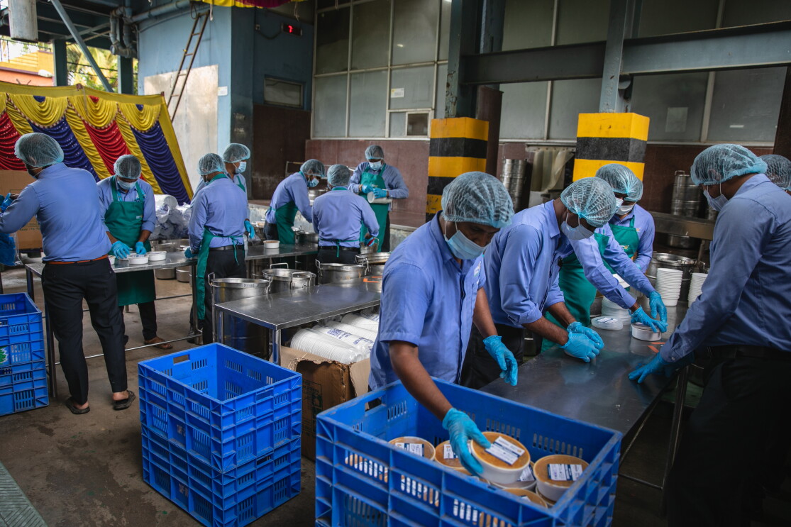 A food distribution drive for creamtorium workers during COVID