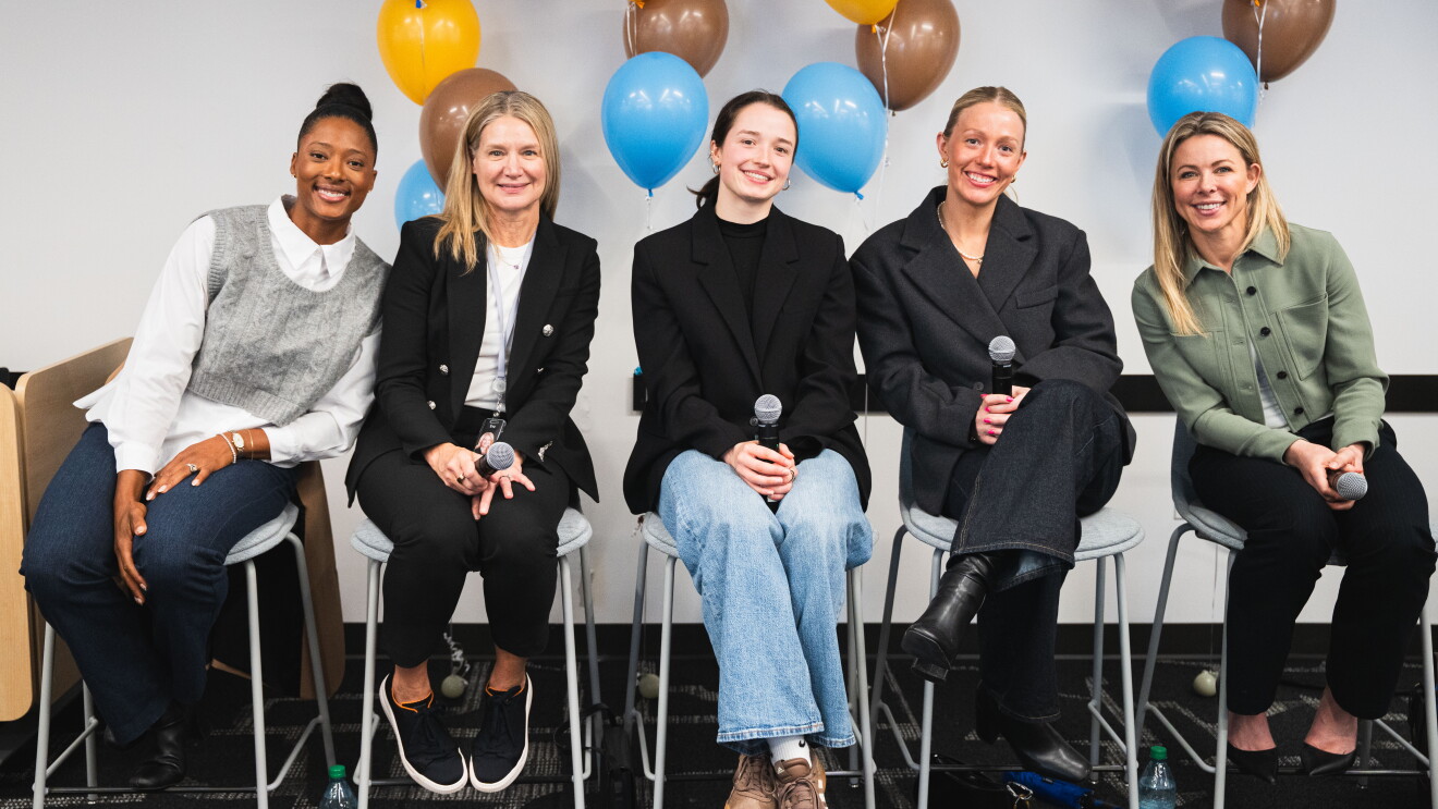 5 women sitting on chairs