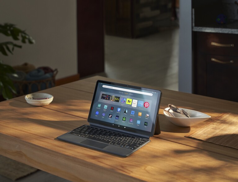 Fire Max 11 Tablet with keyboard displaying app icons on wooden table