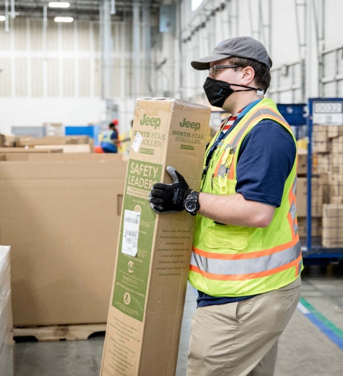 An Amazon employee readies product to be used for disaster relief.