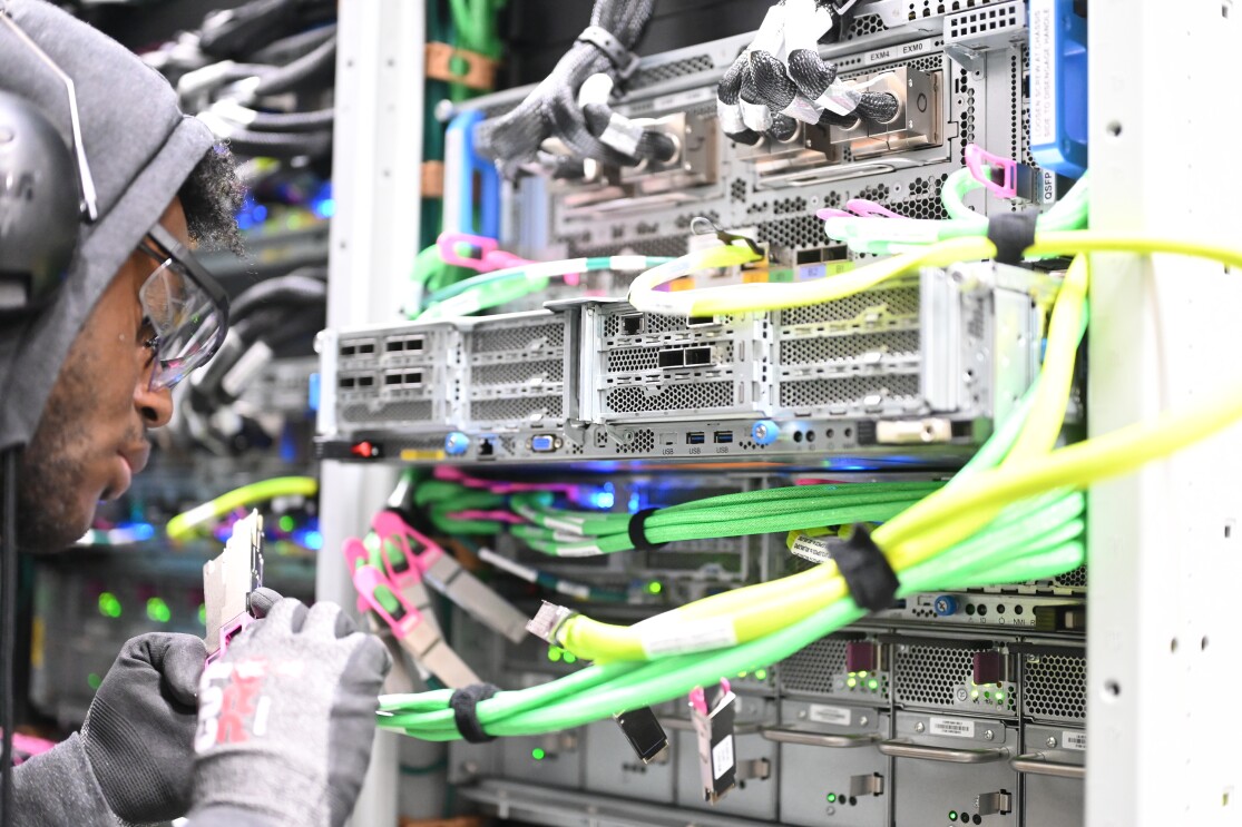 Engineer working on server racks