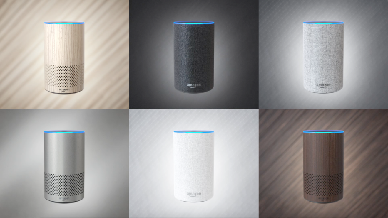 A selection of Amazon Echo devices in wood, black, grey, metallic silver, white, and dark brown.