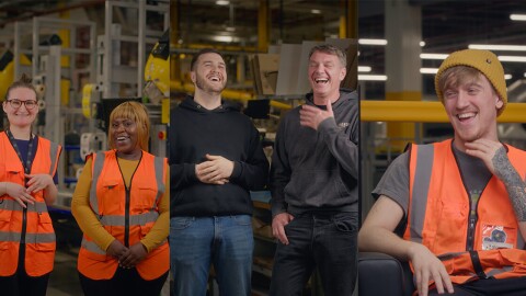 Five Amazon employees standing around a fulfilment centre 