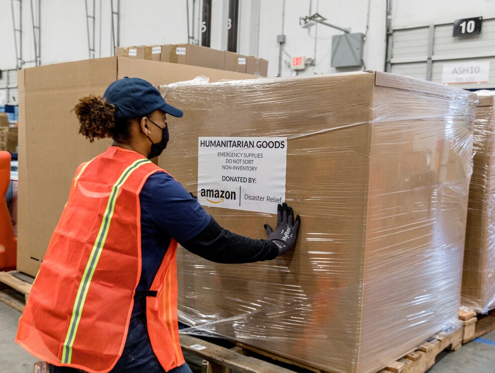 An Amazon employee prepares products for distribution at the Amazon Disaster Relief Hub in Atlanta, Georgia.