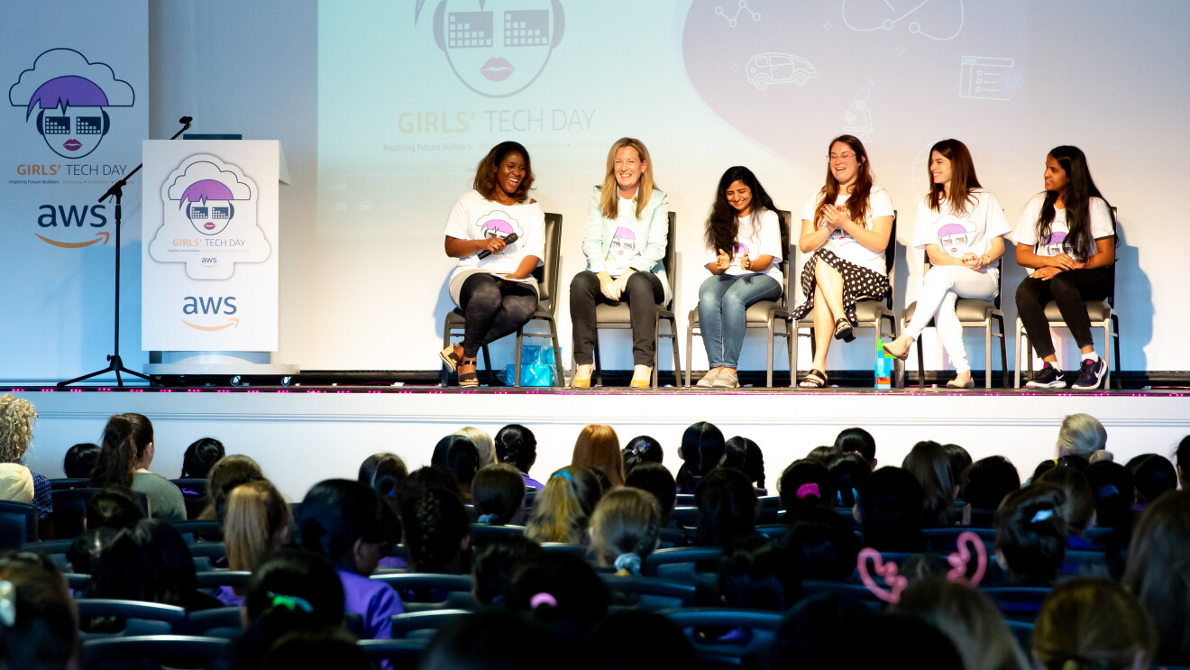 cornelia and other employees host a fireside chat at an event
