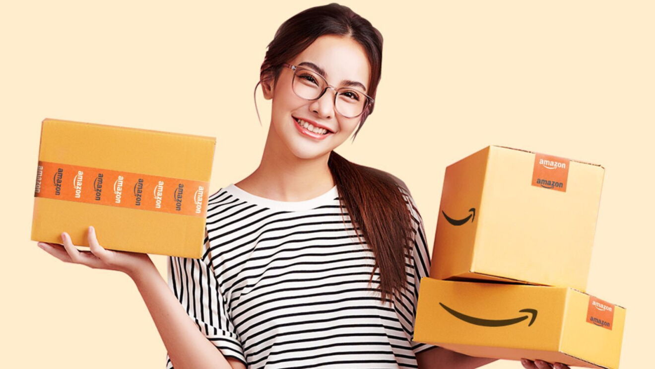A woman holding up three Amazon packages.