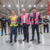 Wayne Angus, director of operations, Amazon Australia, joined by Fairfield City Council Mayor Frank Carbone and Councillor Kevin Lam at a ribbon cutting