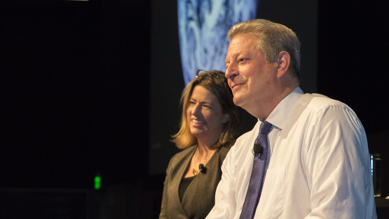 Amazon Director of Sustainability Kara Hurst (L) and Vice President Al Gore on stage at Amazon