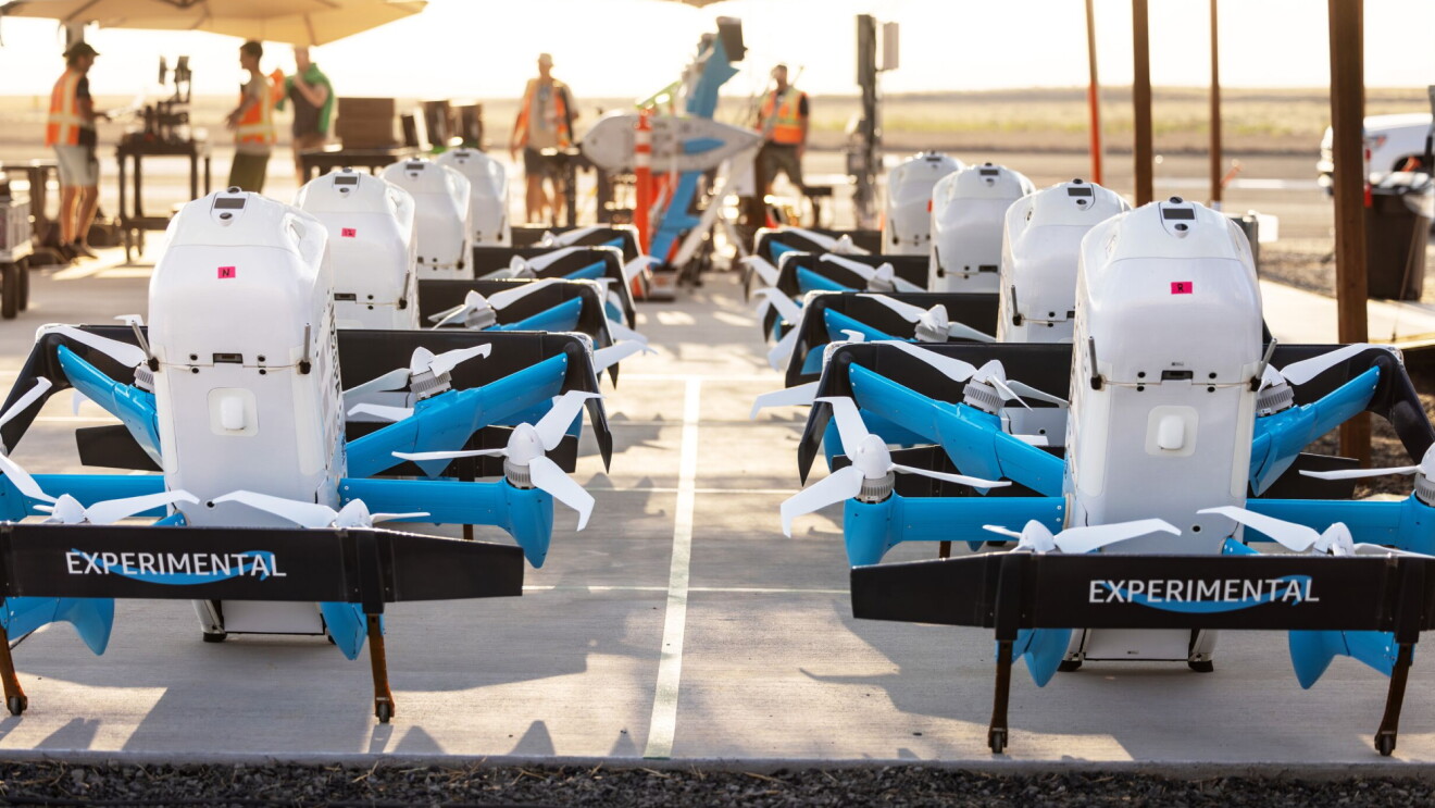 Experimental Prime Air drones lined up at an Amazon test site